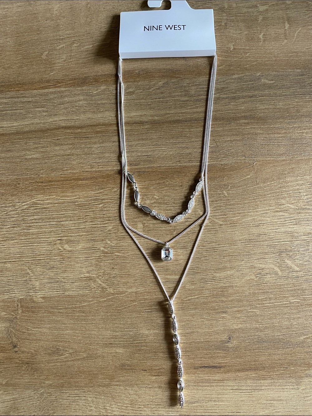 Nine West three tiered silver colored necklace with crystal long pendant